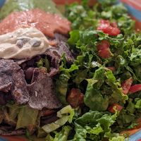 Burrito with salad at Govinda Lila in Cusco