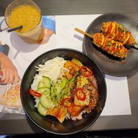 Tropical Juice (Small), Gochujang Rice Bowl with Silken Tofu and Vegan K-Dogs at Wagamama in Swansea