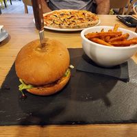 Garden burger and mushroom pizza at Vegan Garden Budapest in Budapest