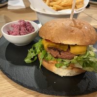 Burger with fries/beet cole slaw. Burger is not Beyond Meat and has an odd after-taste.  at Vegan Garden Budapest in Budapest