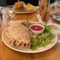 Pizza calzone with spinach  at Vegan Garden Budapest in Budapest