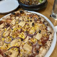 Teriyaki tofu with broccoli and bbq pizzaa  at Vegan Garden Budapest in Budapest