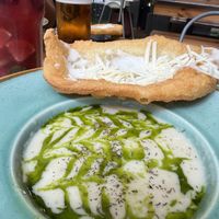 Garlic soup with sour cream, cheese and garlic langosh  at Vegan Garden Budapest in Budapest