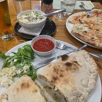Calzone Pizza, with potato salad at Vegan Garden Budapest in Budapest