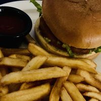 Vegan “chicken” burger with chips and a glass of wine for 11e  at La Miñoca in Lanzarote