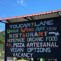 The sign directing you to Toucan Lane. at Toucan Lane Hotel and Restaurant in Nuevo Arenal