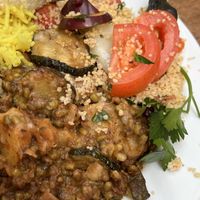 Vegan moussaka (front) with couscous, hummus, & rice sides  at Silk Road Cafe in Dublin