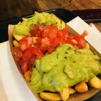 Loaded fries with guacamole and tomatoes   at My Currywurst in Stuttgart