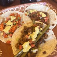 Chorizo, Milanesa and Asada tacos, with toppings    at 100% Vegana Taqueria in Puerto Vallarta