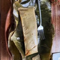 Tamale of the day on a banana leaf (red salsa inside)  at 100% Vegana Taqueria in Puerto Vallarta