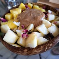 Green smoothie bowls with avocado, kale, and spiraling, chia seefs, apple, pineapple and almond butter. at Varuna Plant-Based Food & Juice Bar in Manuel Antonio
