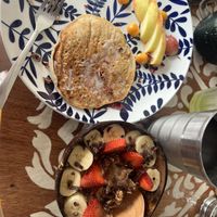 Banana pancakes and cocoa smoothie bowl - yum!   at Varuna Plant-Based Food & Juice Bar in Manuel Antonio