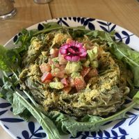 Zucchini noodle pesto with tomato and avocado (served warm) — SO good and fresh!  at Varuna Plant-Based Food & Juice Bar in Manuel Antonio
