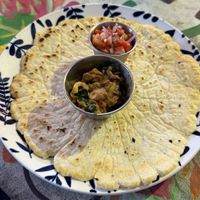 Tortilla with mushrooms. Thats what you get when you order without extras. The tortilla is super thick, brittle and tasteless. Wouldn‘t recommend this dish.  at Varuna Plant-Based Food & Juice Bar in Manuel Antonio