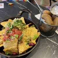 Vegetarian nachos made vegan (remove sour cream and cheese) and Avacado friess  at The Avocado Show in London