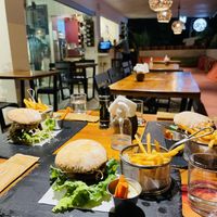 Burger and seating area  at French Cafe in Uvita