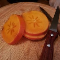 persimmon, or sharon fruit at Bio Marché in Paris