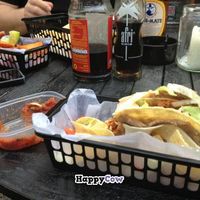 Double-decker tacos, mild salsa to the left, and Tijuana fries in the upper corner at Atacolypse in Leipzig