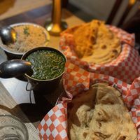 Homestyle spinach daal with cumin rice, paratha and naan   at Khau Gully in Toronto