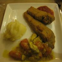 Dinner entree: Something that tasted like wheat gluten, breaded. With mashed potatoes (good) and an avocado/tomato 'salsa' was filling. at Amaltea in Barcelona
