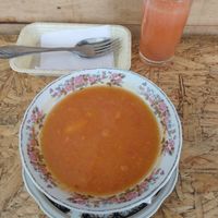 Tomato soup and fruit drink at La María Bistro Veg in Bogota