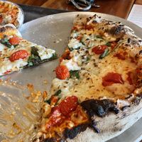 Vegan cheese with cherry tomatoes and spinach   at Wood Fired Pizza in Thomas