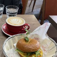 Vegan bagel and oat milk latte  at Coyote Coffee & Deli in Budapest
