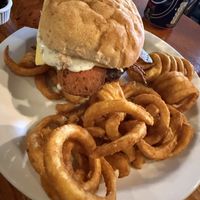 Lamb and mint burger with curly fries   at The Globe in Glossop
