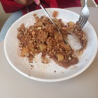 Pancakes with apple compote, date sirup and granola at Oats Day Long in Antwerpen