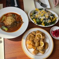 Hot tomato noodle soup, orange chicken, orange salad  at Camouflage in Seoul