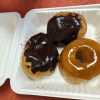 Two Boston Cream, and a Pumpkin spice glazed at Dough House Vegan Donuts in Black Mountain