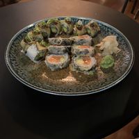 Aubergine inside out Maki with with sun dried tomatoes, cucumber and avocado. (Pictured alongside a melting salmon roll)   at Wawa in South East London