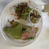 SPRING vegan omelette:
Vegan Eggs, Beet Hummus, Quinoa, Mushrooms, Zucchini, Eggplant, Corn, Caramelized Onions. Served with Salad and Sauteed Potatoes.  at Fit-a-licious in Tulum