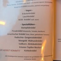 Vegan savory knödel + note at the bottom about them normally coming with olive oil and parmesan at Fink's Südtiroler Knödelküche Zürich in Zurich