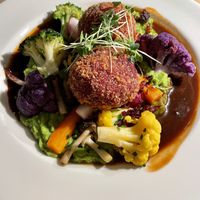 Beet dumplings with cauliflower, carrots, mushrooms, pease pudding and gravy.  at Ratskeller in Stuttgart