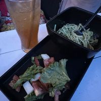 “Creamy” pasta, salad, and kombucha  at Seawiches Lounge Bar in Roatan