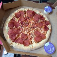 Vegan pepperoni pizza with garlic dips at Domino's Pizza in Hertford