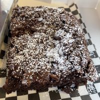 Brownie with choice of topping: powdered sugar, chocolate, strawberries or caramel   at Beg Bakery in Scottsdale