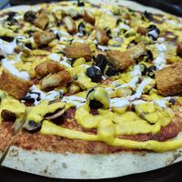 Crispy Pizza:  unfortunately doesn't come with all the ingredients it says on the menu 😡 at Future Diner in Yerevan