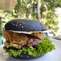 Avocado burger with added fried oyster mushrooms, extremely juicy, highly recommend! at Future Diner in Yerevan