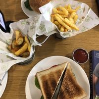 burger, club sandwich, and fries  at Future Diner in Yerevan