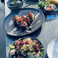 Caesar salad, crunch roll, empanada, pesto croquette  at Nightshade in Vancouver