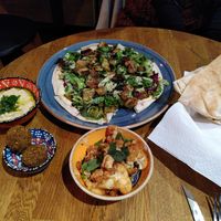 Flat bread with falafel, tahini, and egg plant + babaganoush + falafel + grilled cauli flower. at Ahaaa in Copenhagen