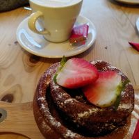 Cinnamon bun and decaf oat latte (Jan 2022) at Leoni in Malton