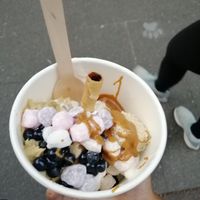 Vanilla frozen yoghurt with blueberry popping pearls, mochi, biscoff, cookie dough and a wafer at Yo-Chi in Surry Hills