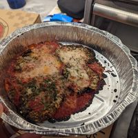 Four thin slices of vegan eggplant Parm for fifteen dollars...... at Ozona Pizza in Palm Harbor