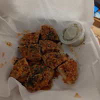 Frozen chicken patties cut in to quarters pegged as "vegan buffalo bites" at Ozona Pizza in Palm Harbor