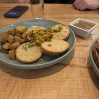 Biscuits and onion gravy on the side  at Fellow Traveler in Englewood