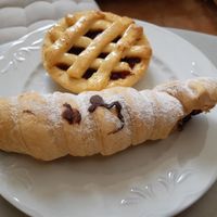 Quince tartlet at the back, chocolate puff pastry cone at the front at Coronados Panaderia Pasteleria & Take Away in Valencia
