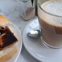 Potato scone roll and a latte at Cafe Mira in Glasgow